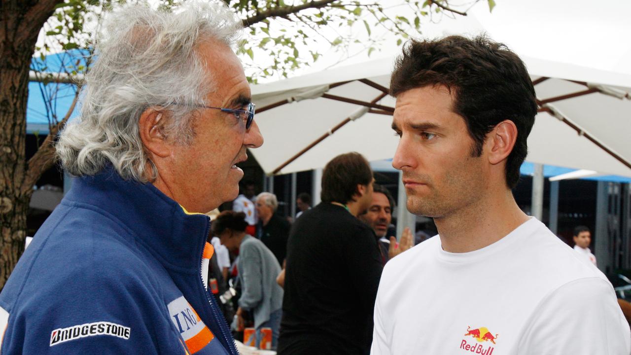 Mark Webber chats with former manager Flavio Briatore at the Australian Grand Prix.