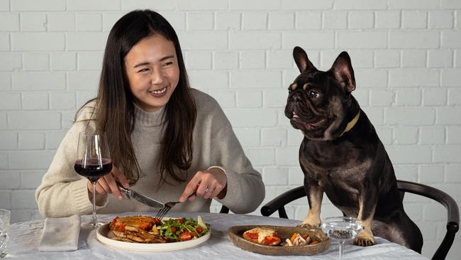 Cheryl Chu with her dog Wilbur enjoying a meal from Dine With Your Dog.