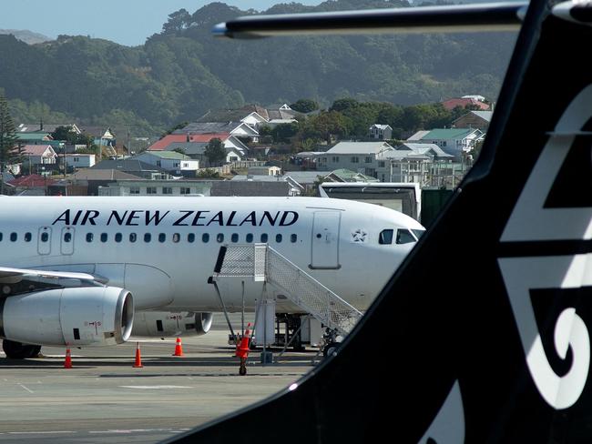 (FILES) This file photo taken on February 20, 2020 shows Air New Zealand planes waiting for passengers at Wellington International Airport. - Air New Zealand posted a record interim loss on February 24, 2022 and warned the airline is set to plunge further into the red as it faces the most difficult year in its history. (Photo by Marty MELVILLE / AFP)