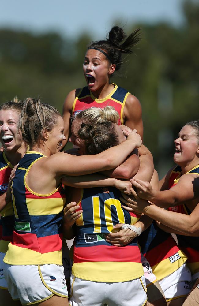 Erin Phillips celebrates her goal in the fourth term with teammates. Picture: Wayne Ludbey