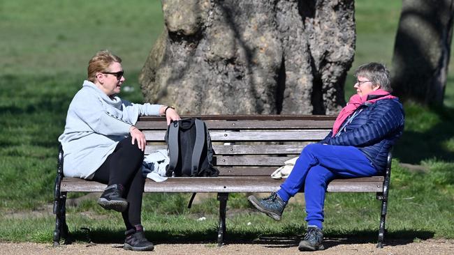 Friends maybe, but these two were keeping their distance as they chatted in Clapham Common in south London. Picture: AFP