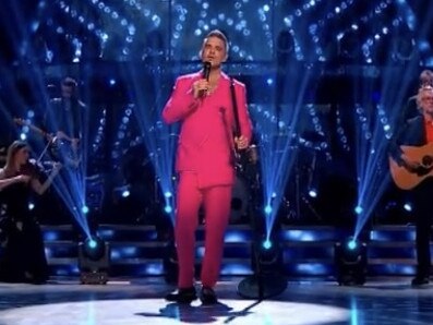 Robbie Williams in his pink suit on Strictly Come Dancing in the UK.