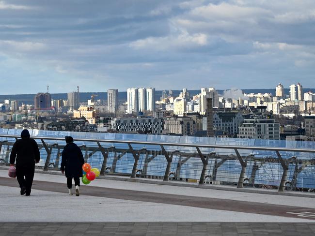 A couple walks on the promenade on Valentine’s Day in Kyiv, amid the Russian invasion of Ukraine. Picture: AFP