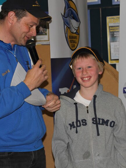 Max Heath accepting a best and fairest at Beaumaris juniors.