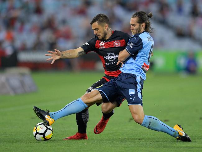 Western Sydney Wanderers’ Josh Risdon (L) battles with Sydney FC’s Joshua Brillante. Pic: Getty