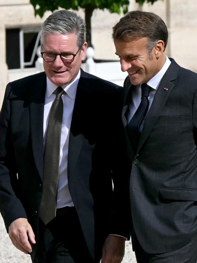 Emmanuel Macron greets Keir Starmer