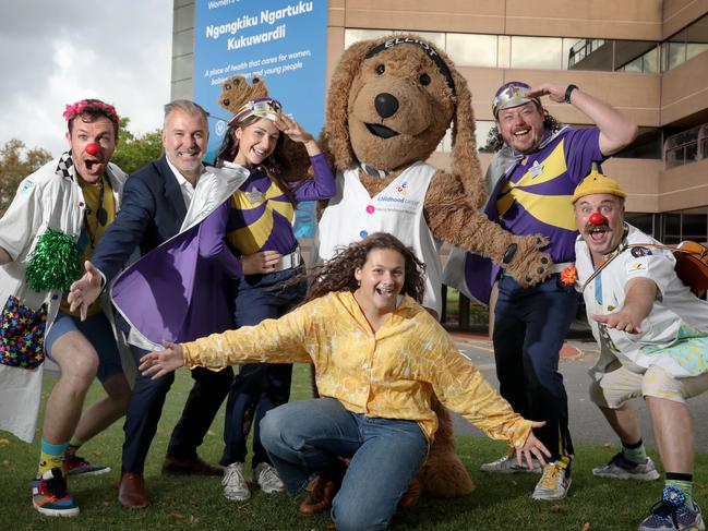 Cancer survivor Holly Mead,15, and the mascots from Childhood Cancer Association (Eliot the dog), Captain Starlights (Plural), and Clown Doctors, Dr Dodo (L), and Dr Bananas (R), with Advertiser FoundationÃ¢â¬â¢s Dan Demaria in front of the Womens' and Children's Hospital. 12 April 2023. Picture Dean Martin