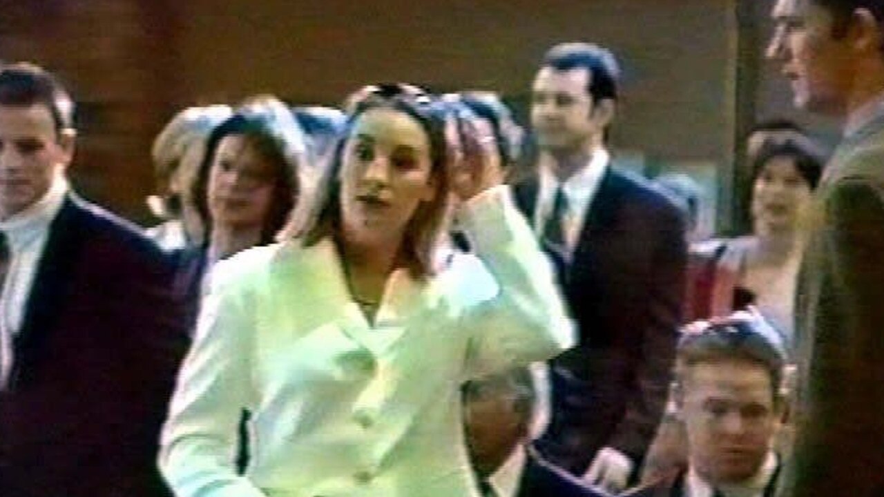 Lane (white coat) attends a 1996 wedding just hours after murdering her newborn child, Tegan.