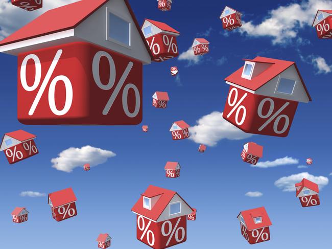 Falling houses with percent symbol on sky background interest rates property generic