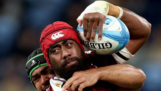 Redsâ Seru Uru (R) is tackled by Waratahs' Jay Fonokalafi (L) during the Super Rugby match between the New South Wales Waratahs and Queensland Reds at the Allianz Stadium in Sydney on May 31, 2024. (Photo by DAVID GRAY / AFP) / -- IMAGE RESTRICTED TO EDITORIAL USE - STRICTLY NO COMMERCIAL USE --