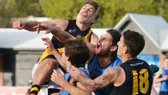 Patullo battles Glenelg’s Chris Curran in the contest last Saturday. Picture: AAP/Brenton Edwards