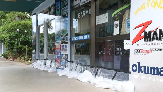 Waterfront businesses at Port Douglas have been braced against the looming storm. Picture: Peter Carruthers