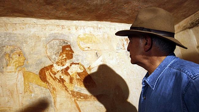 Zahi Hawass, former head of Egypt's Supreme Council of Antiquities, tours a recently discovered tomb of a priest near the Giza Pyramids.