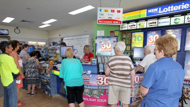 Punters purchase tickets for the Powerball.