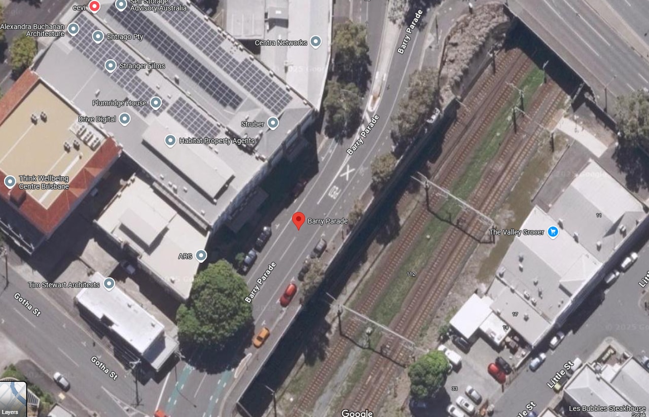 Aerial image of Barry Pde in Fortitude Valley showing four cars parked in what is now a bus zone. The previous, smaller bus zone is behind the parked cars.