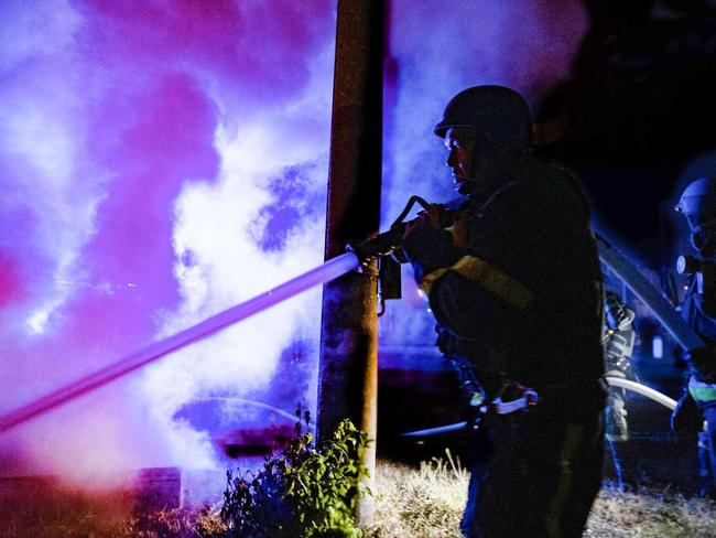 Rescuers at the site of a drone attack in Kyiv. Russian forces launched 32 explosive drones over Ukraine, mostly over the Kyiv region. Picture: Handout / Ukrainian Emergency Service / AFP