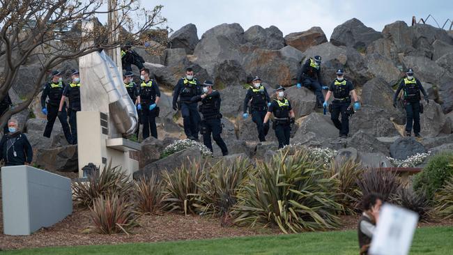 Police scour the park. Picture: Tony Gough