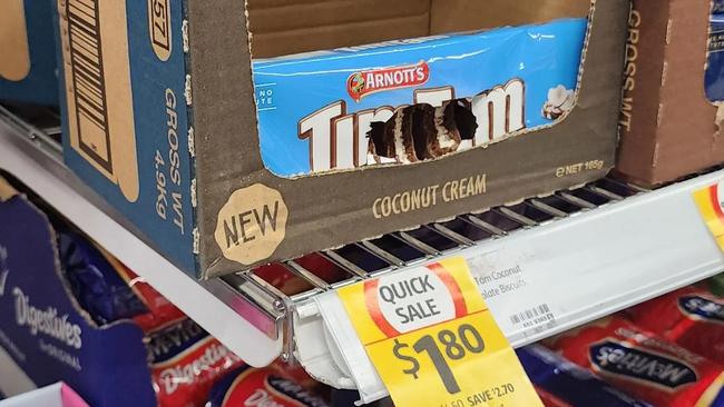 An outraged Coles customer has shared a photo of a Tim Tam packet seemingly ravaged by pests. Picture: Reddit