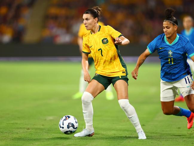 Steph Catley (left) controls the ball as Brazilian goalscorer Amanda Gutierres looms at Suncorp Stadium on Thursday night. Picture: Chris Hyde/Getty Images