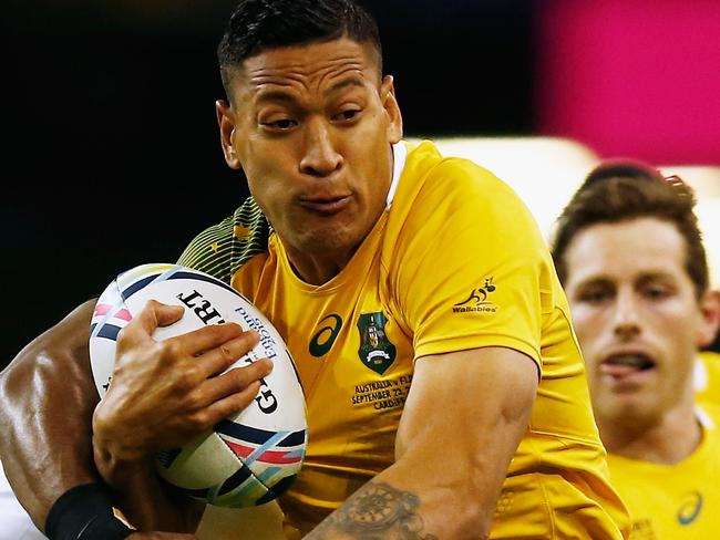 CARDIFF, WALES - SEPTEMBER 23: Israel Folau of Australia makes a break during the 2015 Rugby World Cup Pool A match between Australia and Fiji at the Millennium Stadium on September 23, 2015 in Cardiff, United Kingdom. (Photo by Laurence Griffiths/Getty Images)