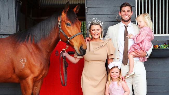 Geelong star Tom Hawkins, wife Emma and their two children Arabella 4 and Primrose 2 years old. Picture: Rebecca Michael