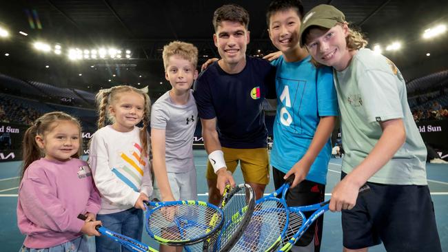 World No.2 Carlos Alcaraz with Sophie, 3, Cami, 5, Toby, 11, Bob, 11, and Callum, 13 on Rod Laver Arena. Picture: Tony Gough