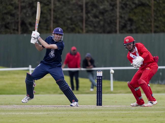 Carlton batsman Tom Smyth cuts, watched by Swans keeper Devin Pollock. Picture: Valeriu Campan