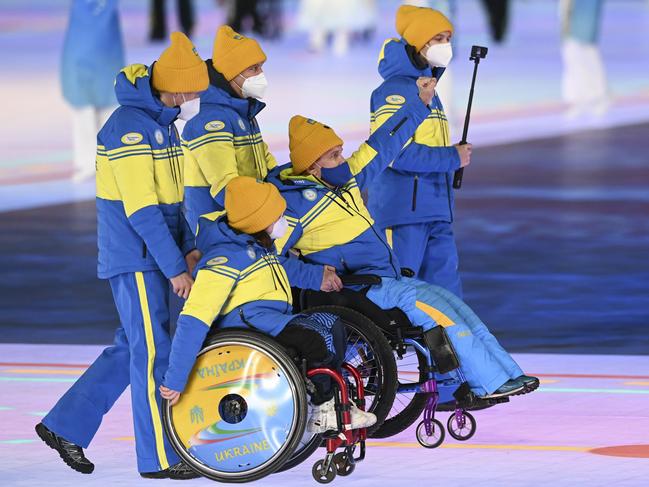 Members of Team Ukraine wave during the Opening Ceremony of the Beijing 2022 Winter Paralympics. Picture: Getty