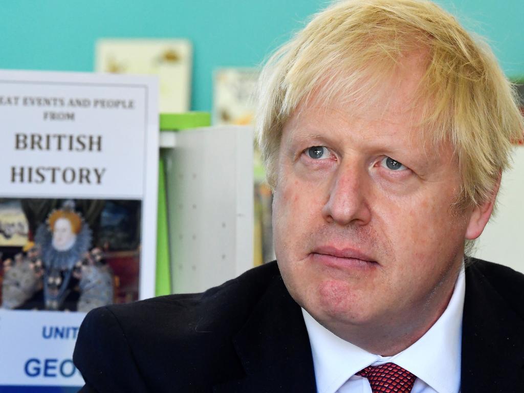 Listen up kids. Britain’s Prime Minister Boris Johnson visits a school in London and may be reflecting on his own place in British history. Picture: Toby Melville/AFP.