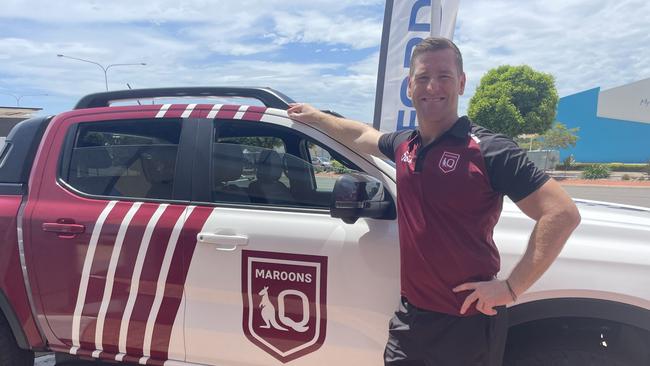 Former Maroons player Brent Tate with the Ford Ranger being raffled off as part of the QRL's regional road trip.