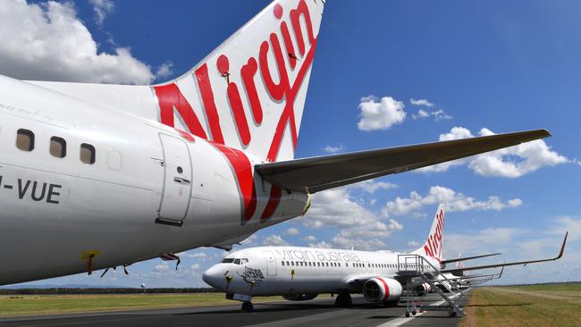 Grounded Virgin Australia aircraft parked at Brisbane Airport in Brisbane. Picture: AAP/ Darren England.