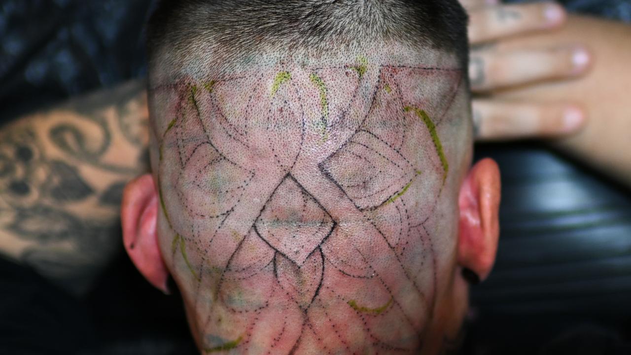 Tattoo enthusiasts receive fresh ink at the Australian Tattoo Expo in Brisbane. Picture: Dan Peled / NewsWire