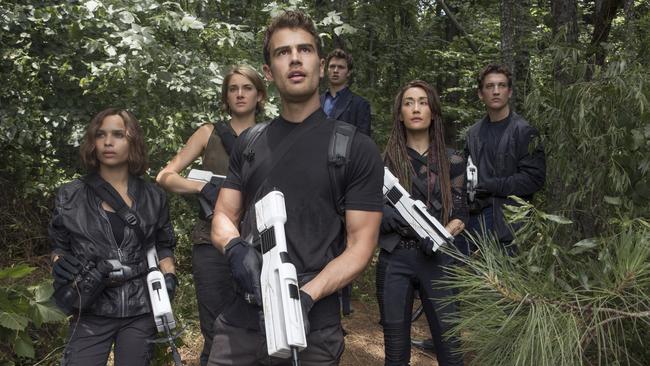 This image released by Lionsgate shows from left, Zoe Kravitz, Shailene Woodley, Theo James, Ansel Elgort, Maggie Q and Miles Teller in a scene from "The Divergent Series: Allegiant." (Murray Close/Lionsgate via AP)