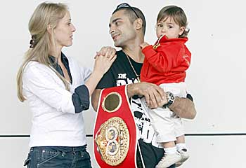 Home comforts ... Darchinyan with his wife and daughter. James Croucher