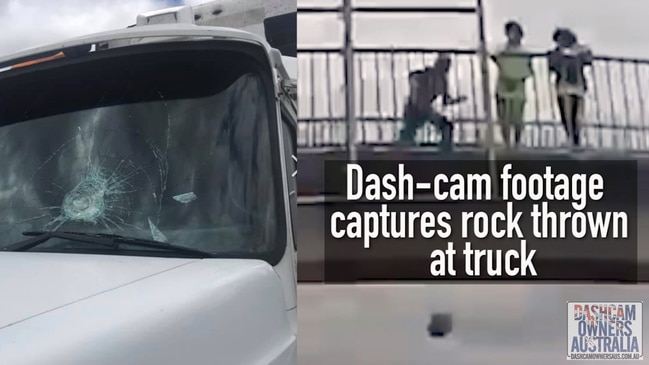 Dash-cam footage captures rocks thrown at a truck