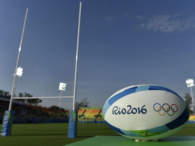 A rugby ball is placed on the field before matches of the women’s rugby sevens event during the Rio 2016 Olympic Games at Deodoro Stadium in Rio de Janeiro on August 6, 2016. / AFP PHOTO / PHILIPPE LOPEZ