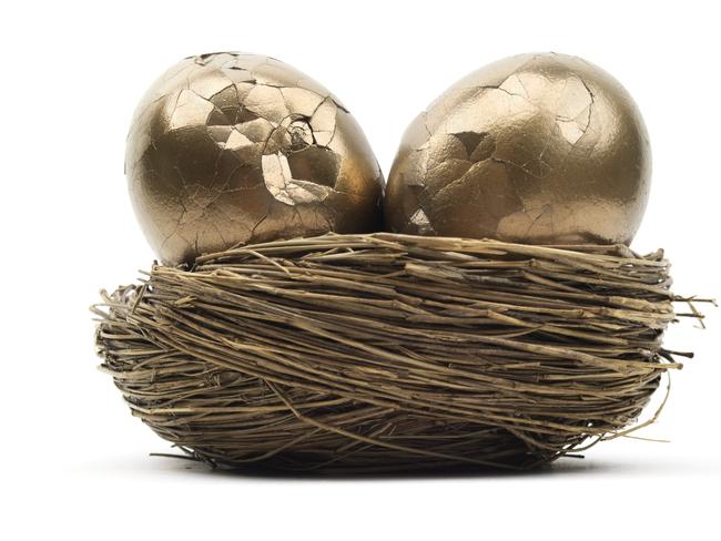 Isolated broken golden eggs in nest egg, superannuation cracked generic