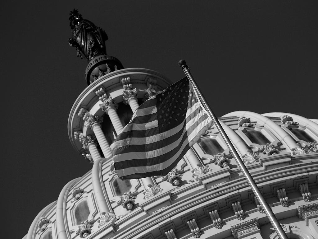 An American flag waves outside the United States Capitol building. The debate about the separation of church and state is heating up. Picture: AFP