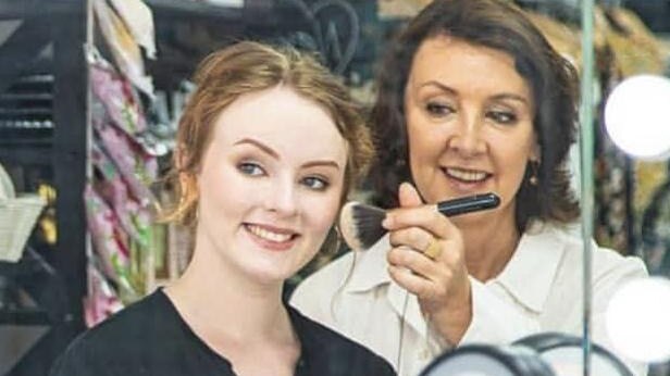 Makeup artist Karine Hughes with a customer. Picture: Supplied