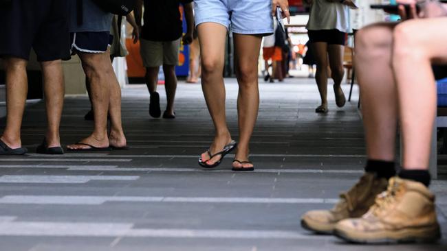 Tourists walk along the Esplanade Dining Precinct near the Crystalbrook Flynn hotel in Cairns’ CBD. Cairns Regional Council spent $28m upgrading the waterfront precinct between Shields Street and Aplin Street in a bid to attract more foot traffic and discourage vehicles from using the thoroughfare. Picture: Brendan Radke