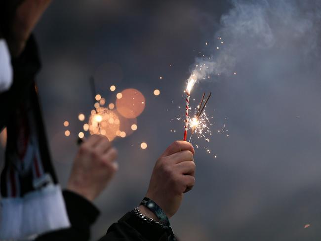 HAMBURG, GERMANY - DECEMBER 14: St. Pauli fans show their support with flares and sparklers during the Bundesliga match between FC St. Pauli 1910 and SV Werder Bremen at Millerntor Stadium on December 14, 2024 in Hamburg, Germany. (Photo by Selim Sudheimer/Getty Images)