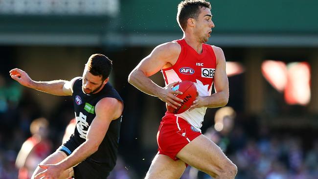 Xavier Richards leaves a Carlton opponent in his wake.