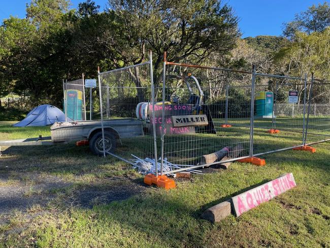 The cryptic protest along Tumbi Rd at Wamberal has all but been shut down after Central Coast Council contacted the organiser and told him to get rid of it. Picture: NewsLocal