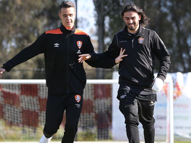 Brisbane Roar defender Aaron Reardon with Knights player Jayden Prasad ahead of the Surf City Cup that kicks off tonight. Picture: Glenn Hampson