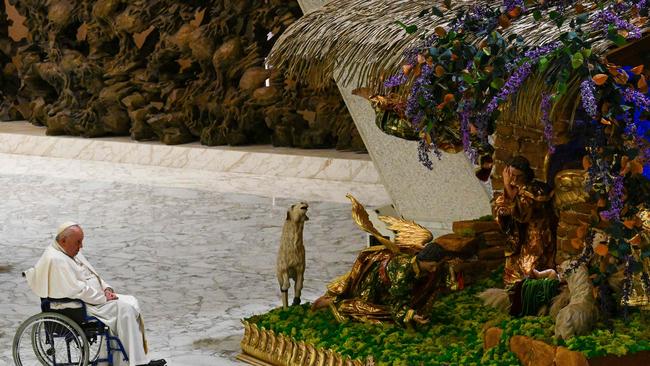 Pope Francis prays by a Nativity Scene in The Vatican.