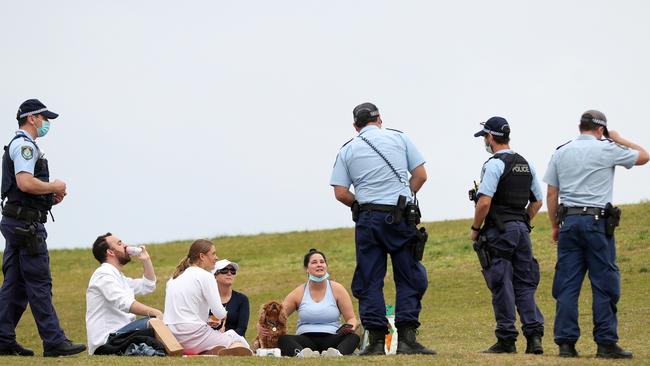 Police patrol in Sydney on Saturday as people enjoy new rules allowing them to gather in groups of five, within limited areas, if all are fully vaccinated. Picture: Brendon Thorne/Getty Images