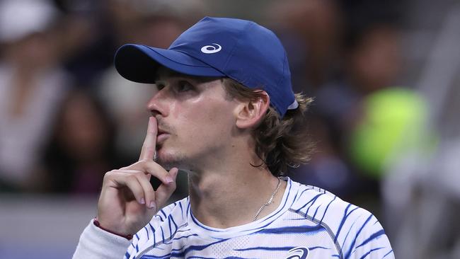 NEW YORK, NEW YORK - AUGUST 31: Alex de Minaur of Australia motions to the crowd to stop booing against Daniel Evans of Great Britain for losingduring their Men's Singles Third Round match on Day Six of the 2024 US Open at USTA Billie Jean King National Tennis Center on August 31, 2024 in the Flushing neighborhood of the Queens borough of New York City. (Photo by Matthew Stockman/Getty Images)