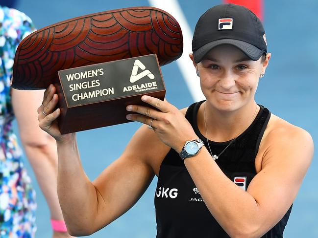 ADELAIDE, AUSTRALIA - JANUARY 09: Ashleigh Barty of Australia  holds the Womens Singles Champion trophy after defeating Elena Rybakina of Kazakhstan during day eight of the 2022 Adelaide International at Memorial Drive on January 09, 2022 in Adelaide, Australia. (Photo by Mark Brake/Getty Images)