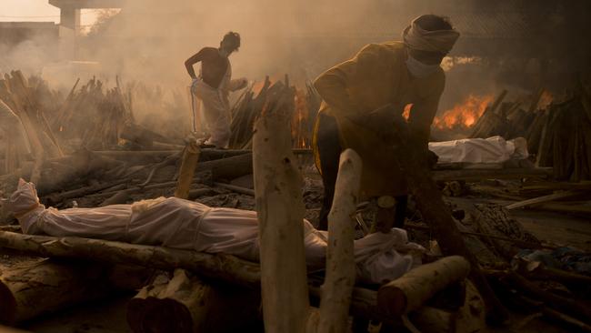 A priest prepares to perform the last rites on a Covid victim at a crematorium in New Delhi on Saturday. Picture: Getty Images