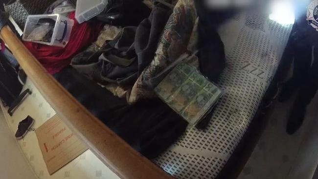 Detectives have charged six people following a raid for cash and drugs at a West Mackay home. Picture: Supplied